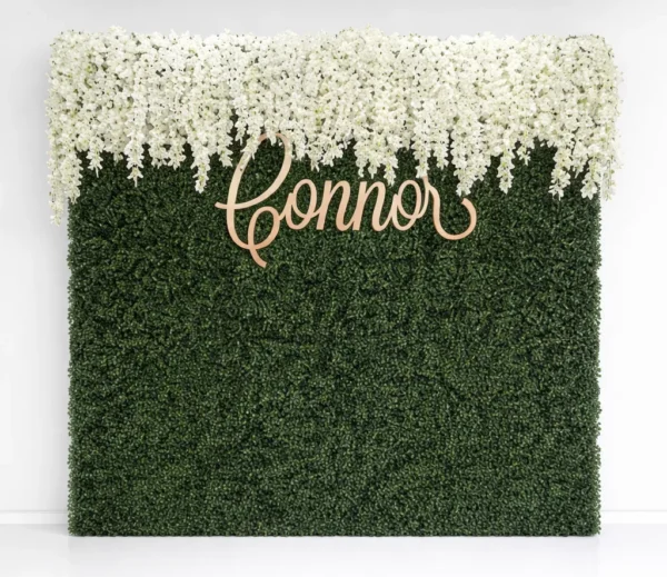BOXWOOD WALL WITH SILK FLORAL RUNNER AND MONOGRAM